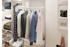 White GTV pull-down wardrobe rail lowered in a fitted wardrobe with hanging clothes