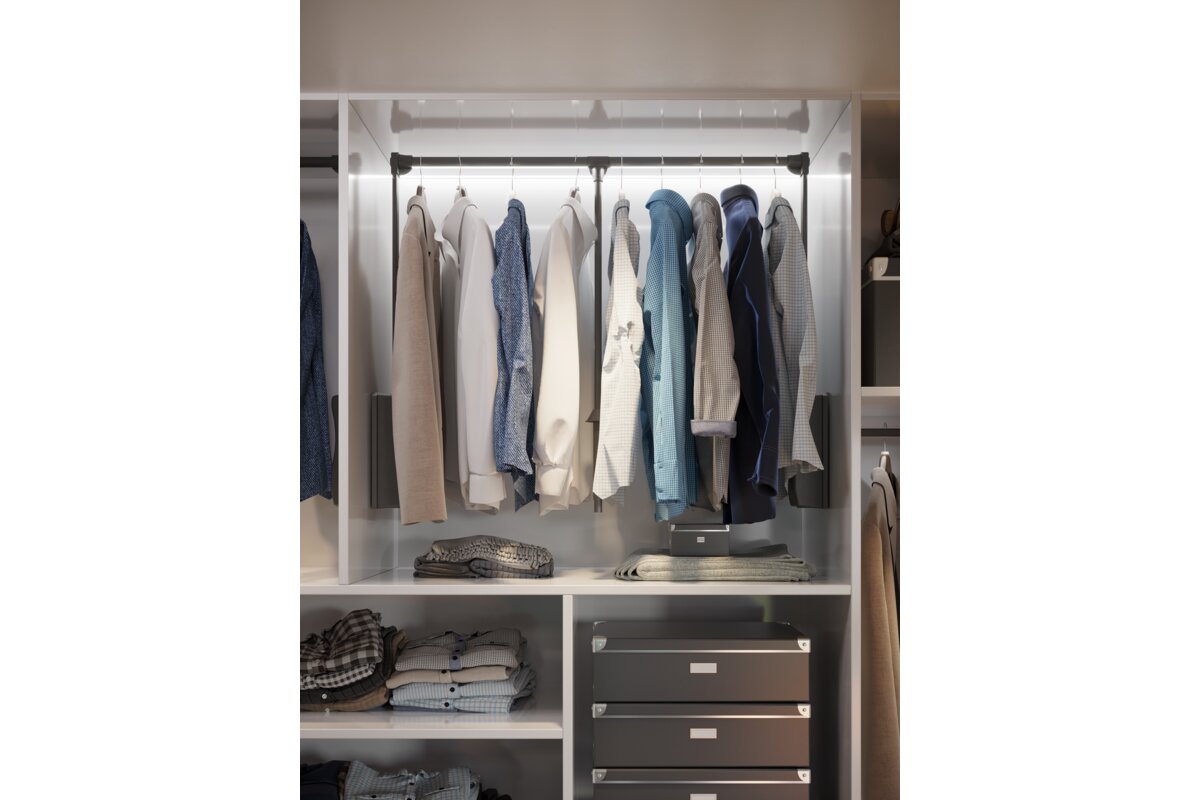 Anthracite pull-down wardrobe rail fitted inside a wardrobe with hanging clothes