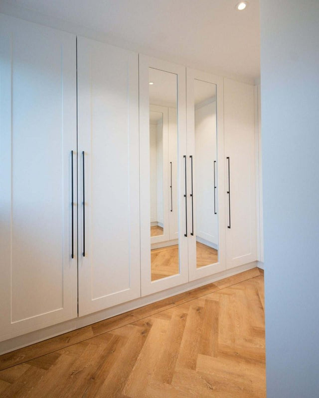 Fitted wardrobes with long bar handles